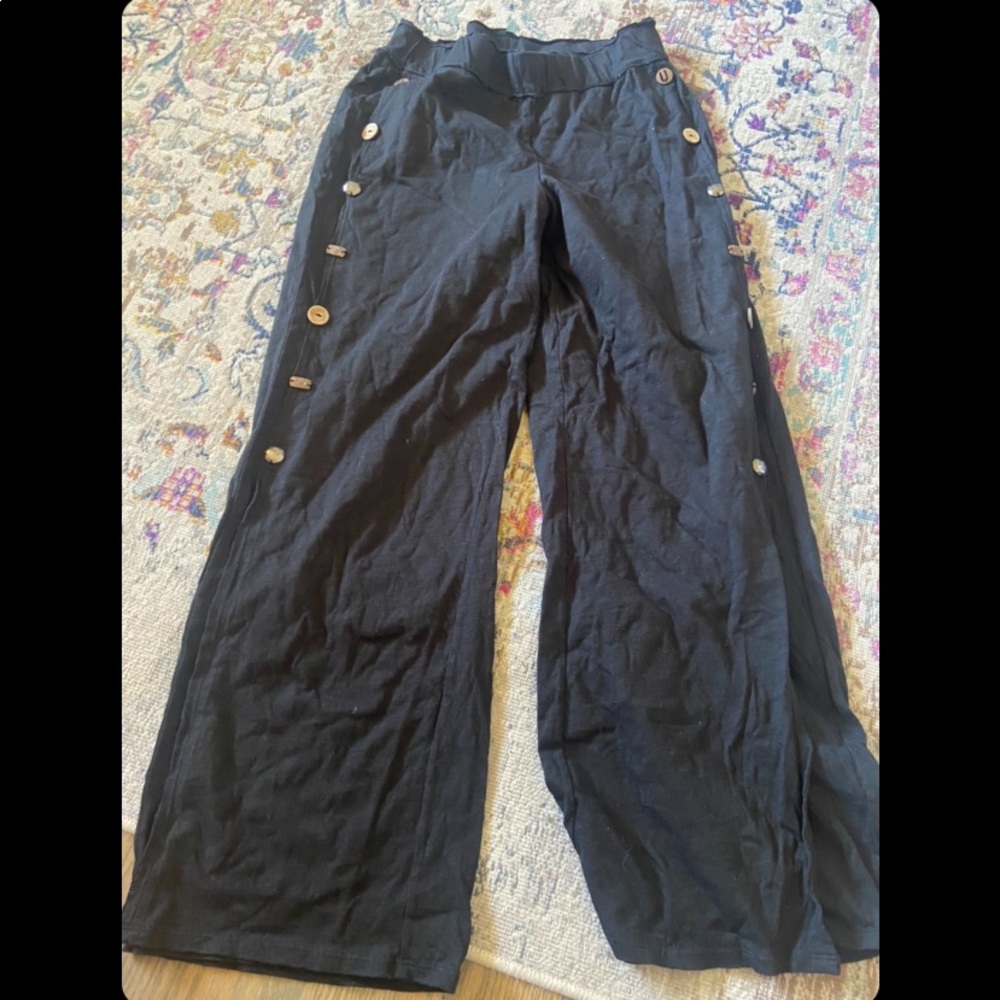 black pants with wooden button details